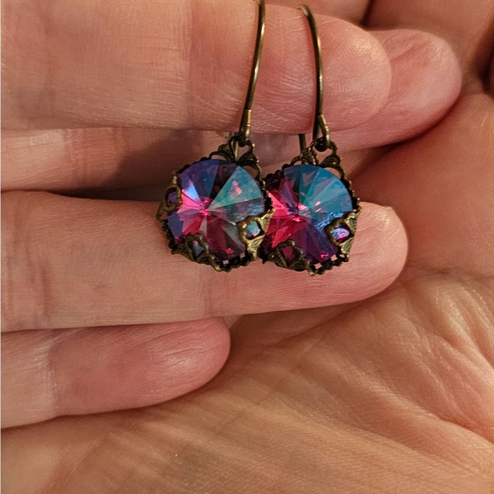 Dark pink crystal and brass dangle earrings